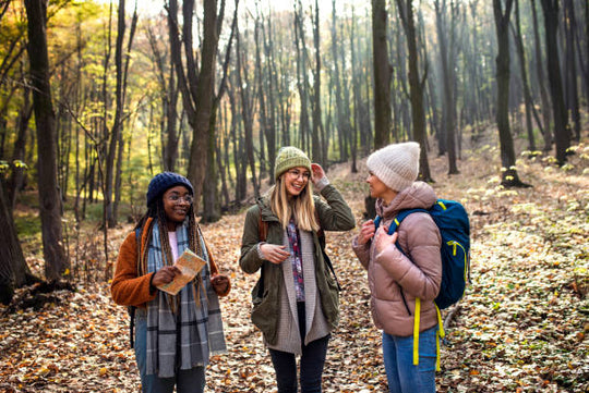 Students in the forest going for a walk. 